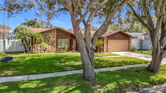 single story home with a garage and a front yard