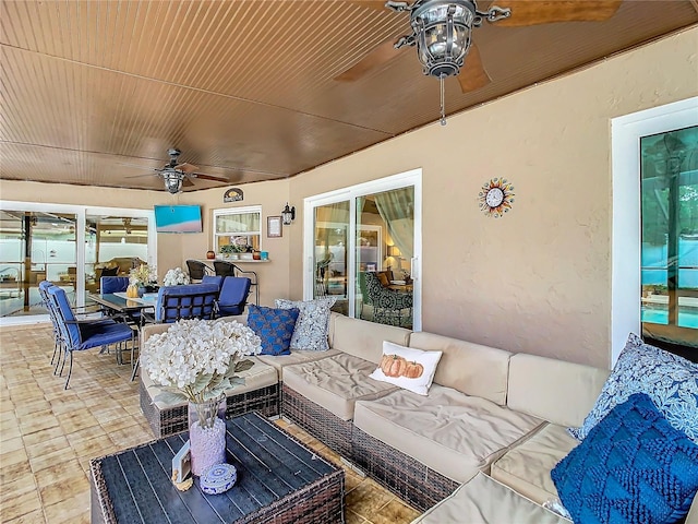 view of patio with ceiling fan and outdoor lounge area