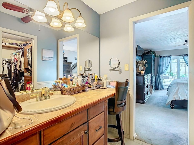 bathroom with vanity and ceiling fan