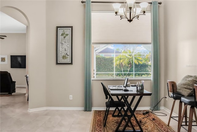 tiled home office featuring an inviting chandelier