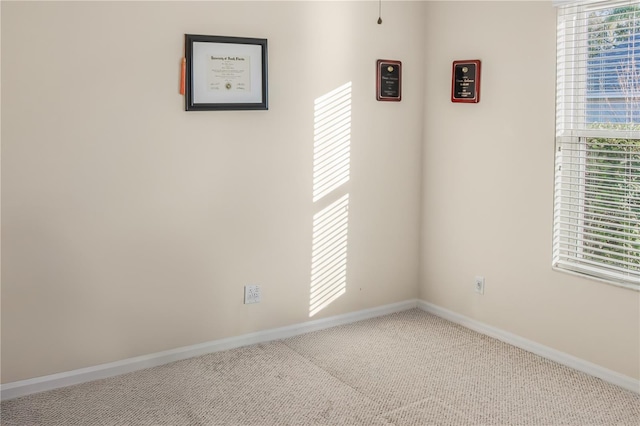 spare room featuring carpet flooring