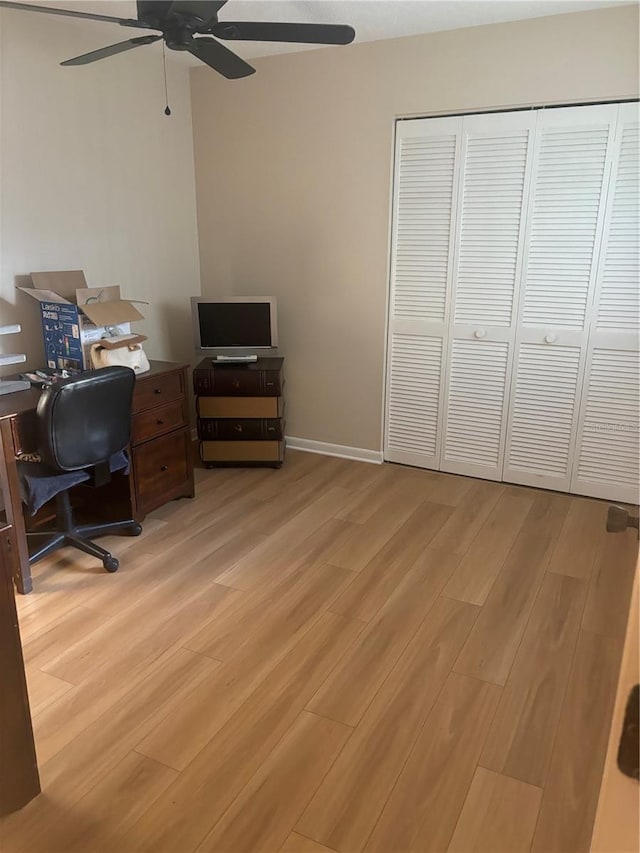 office space featuring light hardwood / wood-style flooring and ceiling fan