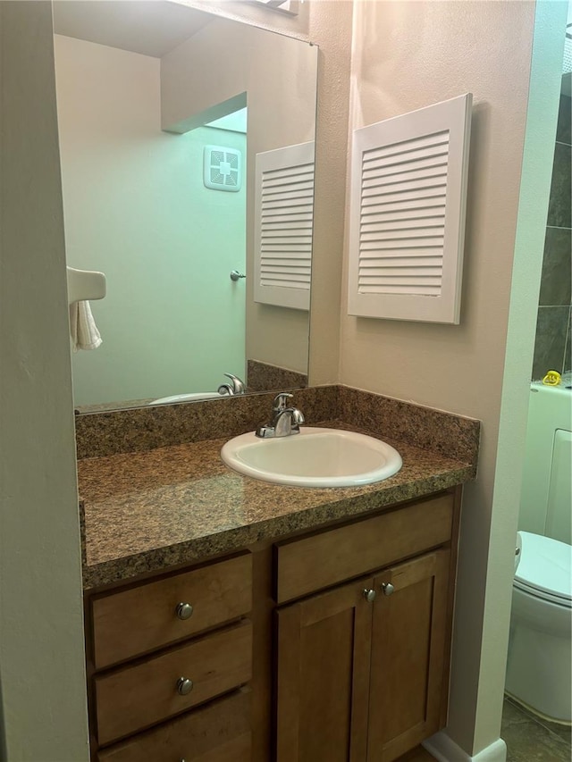 bathroom with vanity and toilet