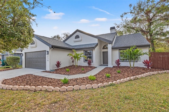 ranch-style home featuring a garage and a front yard