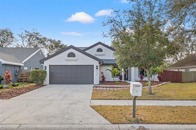 view of front facade with a garage and a front yard