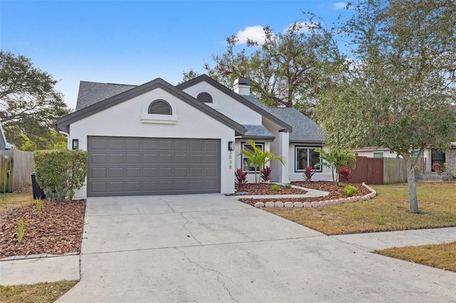 ranch-style home with a garage and a front yard