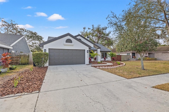 view of front of property featuring a garage and a front yard