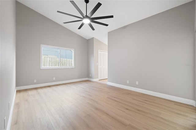 spare room featuring ceiling fan, high vaulted ceiling, and light hardwood / wood-style floors