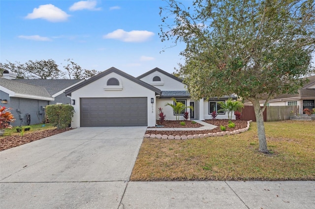 view of front of home featuring a garage and a front yard