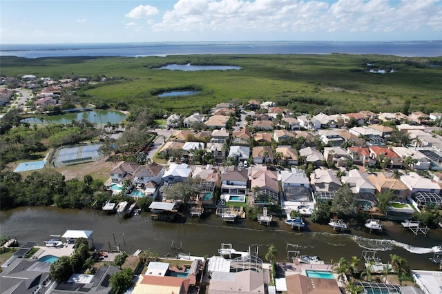 bird's eye view with a water view and a residential view