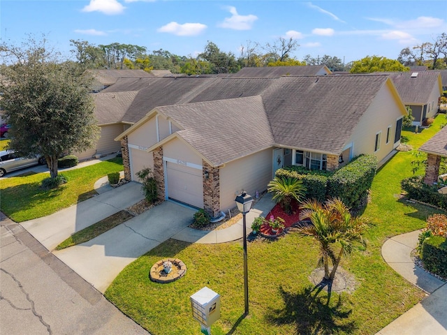 single story home with a garage and a front yard