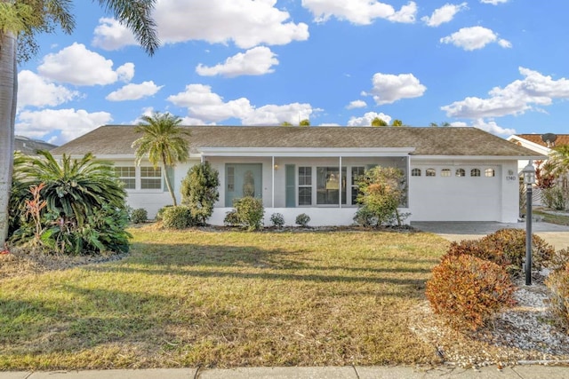 ranch-style house with a garage and a front yard