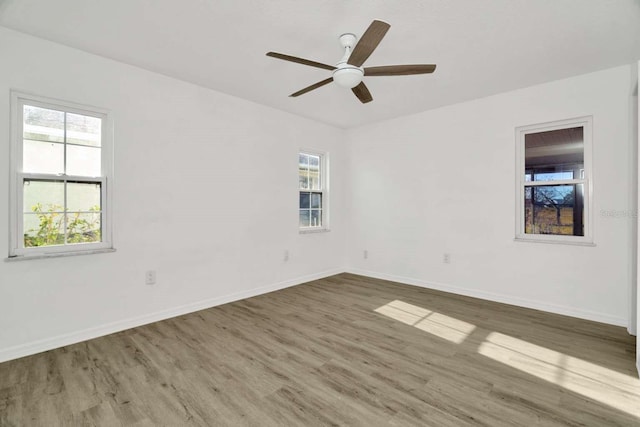 unfurnished room featuring ceiling fan and wood-type flooring