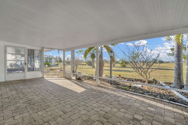 unfurnished sunroom with a healthy amount of sunlight