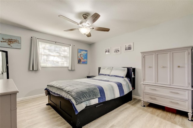 bedroom featuring ceiling fan and light hardwood / wood-style floors