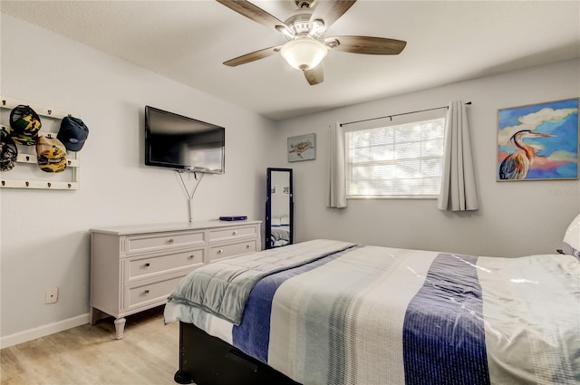 bedroom featuring light hardwood / wood-style flooring and ceiling fan