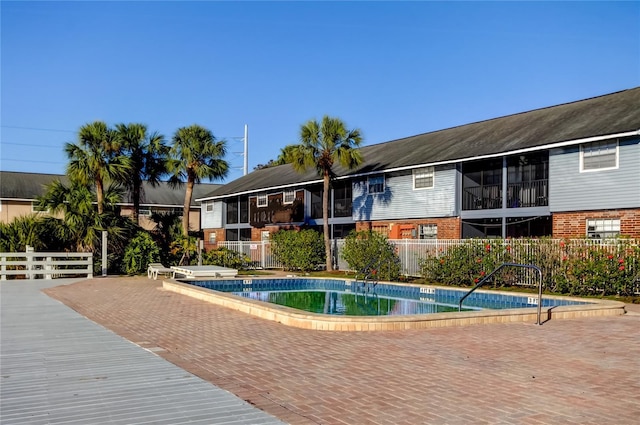 view of swimming pool with a patio area