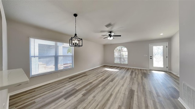 interior space with ceiling fan and light hardwood / wood-style floors