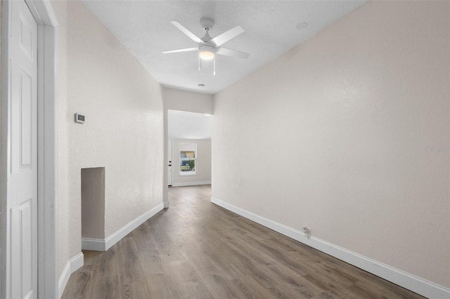 corridor featuring hardwood / wood-style floors