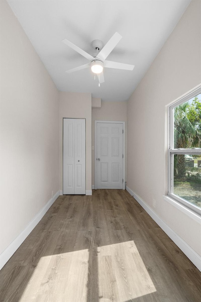 unfurnished bedroom with light hardwood / wood-style floors and ceiling fan