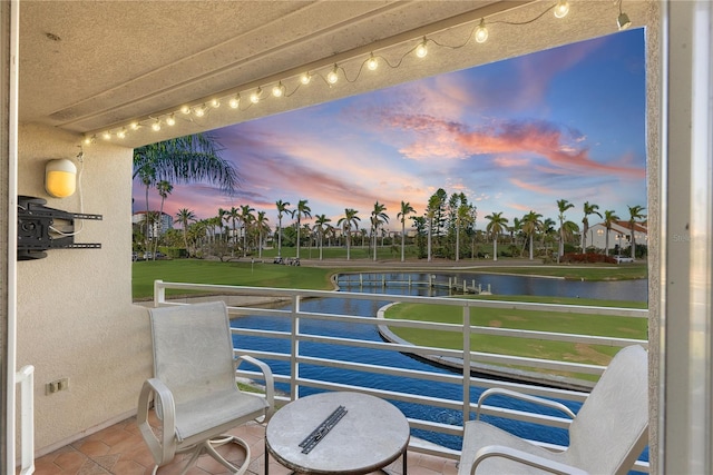 balcony at dusk with a water view