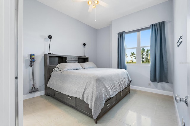 tiled bedroom featuring ceiling fan and vaulted ceiling