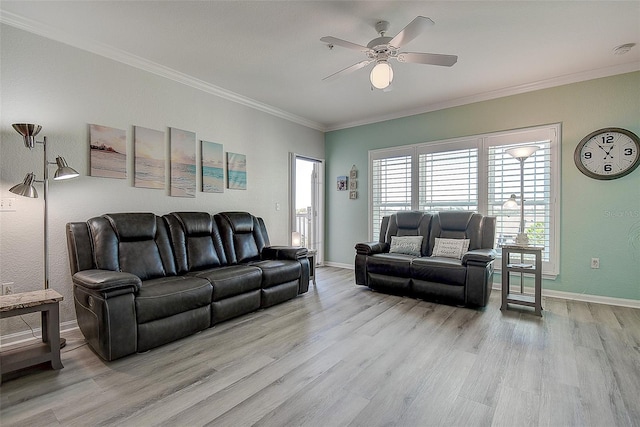 living room with crown molding, light hardwood / wood-style floors, and ceiling fan