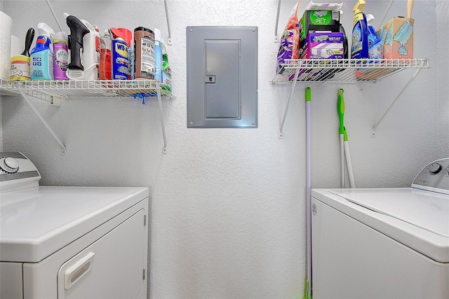 washroom featuring electric panel and washing machine and dryer