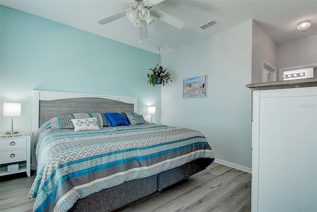 bedroom featuring ceiling fan and light hardwood / wood-style flooring