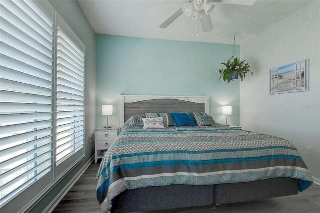 bedroom featuring dark wood-type flooring and ceiling fan