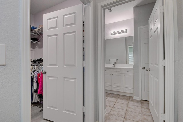 bathroom featuring vanity and tile patterned floors