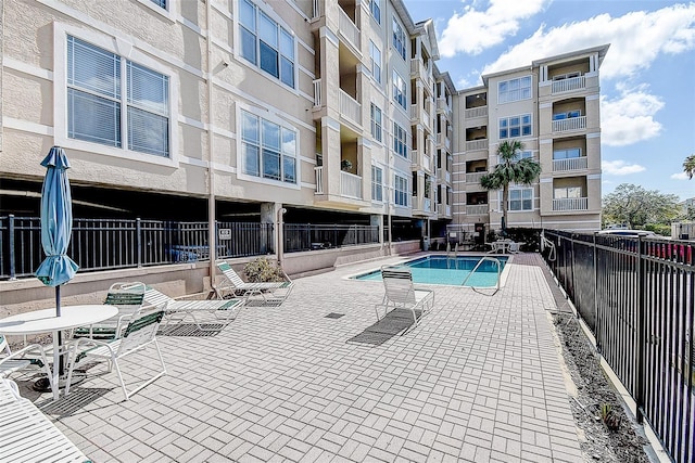 view of pool featuring a patio area