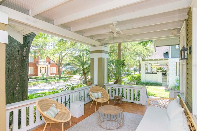 view of patio with ceiling fan and a porch