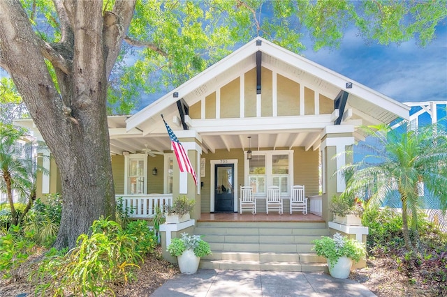 exterior space with a porch and a ceiling fan