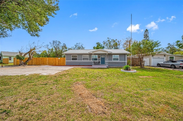 ranch-style house with covered porch and a front lawn