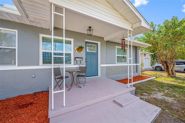 doorway to property with covered porch