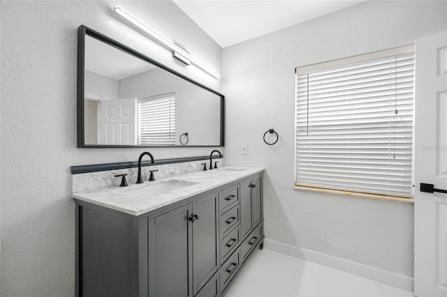 bathroom featuring vanity and tile patterned flooring