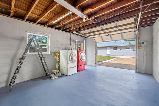 garage with washing machine and dryer