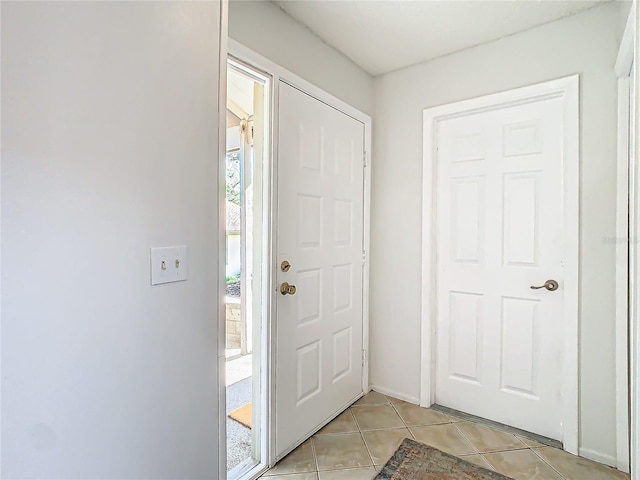 foyer with light tile patterned floors