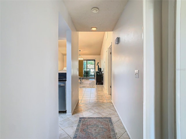 hallway with light tile patterned floors