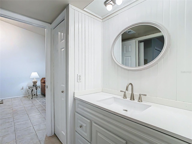 bathroom with tile patterned floors and vanity