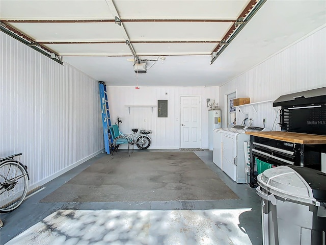 garage with a garage door opener, separate washer and dryer, and electric panel