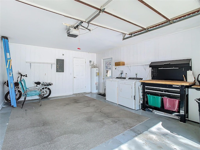 garage with a garage door opener, electric panel, electric water heater, and washing machine and clothes dryer