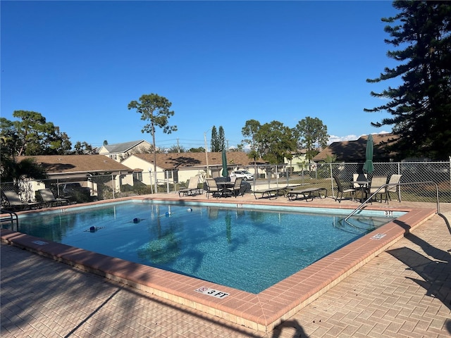 view of pool featuring a patio area