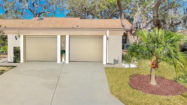 garage featuring driveway