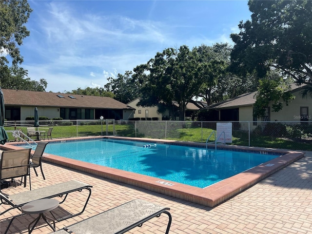 2606 Oak Cir, Tarpon Springs, FL 34689 - community pool featuring a patio area