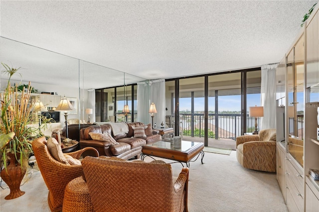 carpeted living room with a wall of windows, a textured ceiling, and a water view