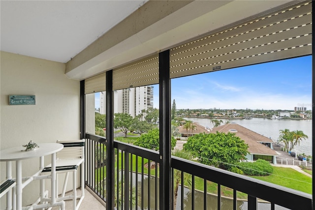 balcony featuring a water view