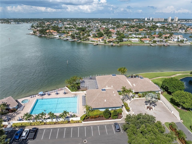 birds eye view of property with a water view