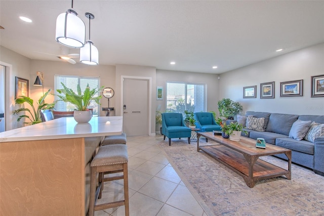 living area with light tile patterned flooring and recessed lighting